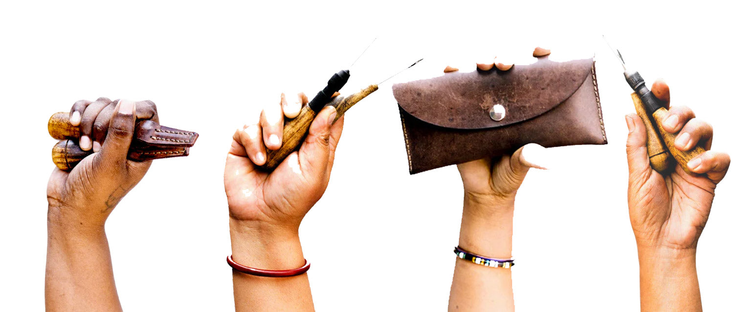 Artisan hands with leather working tools