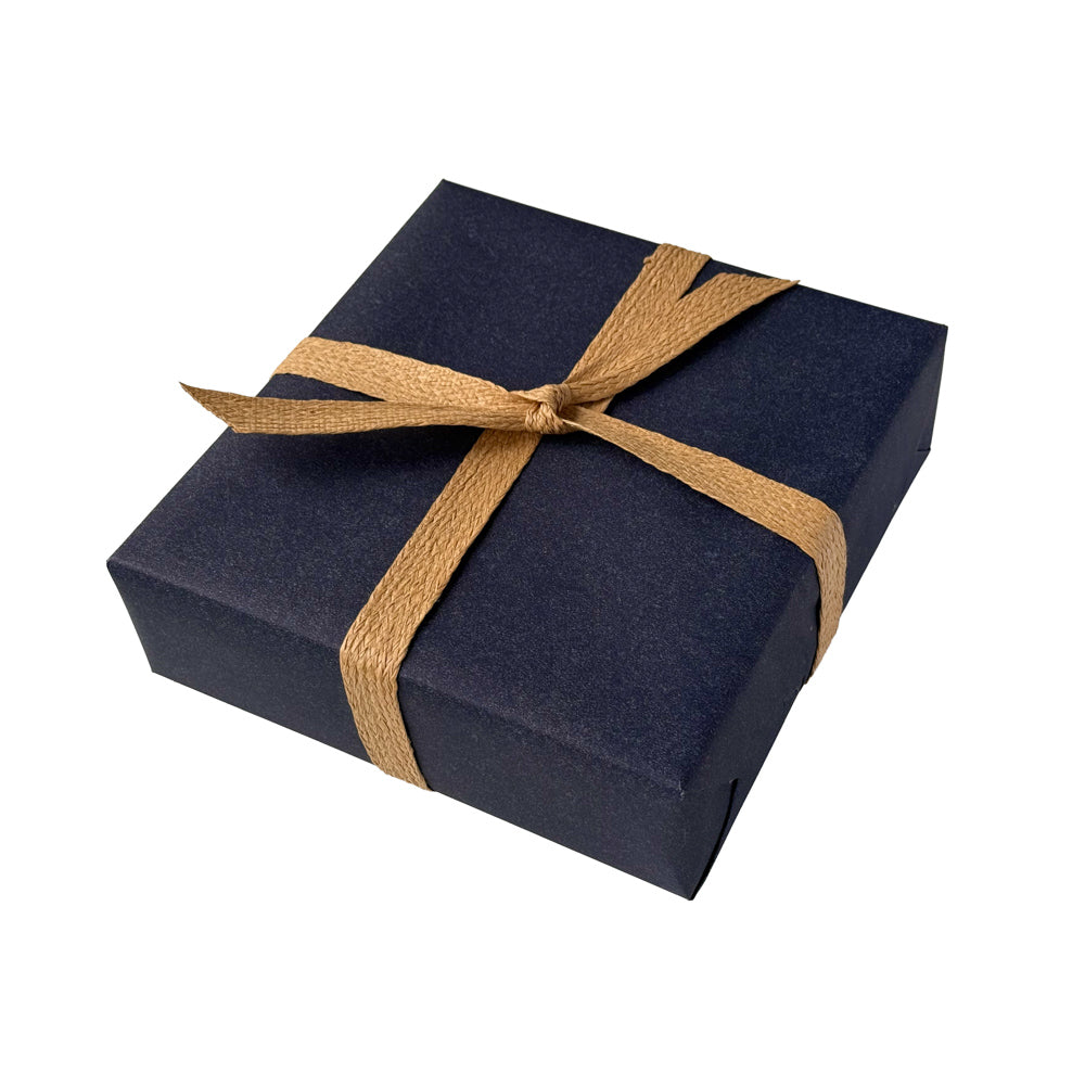 Navy blue gift wrapping with a natural  paper ribbon